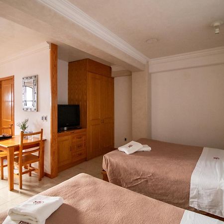 Suites Sevilla Πουέμπλα Εξωτερικό φωτογραφία